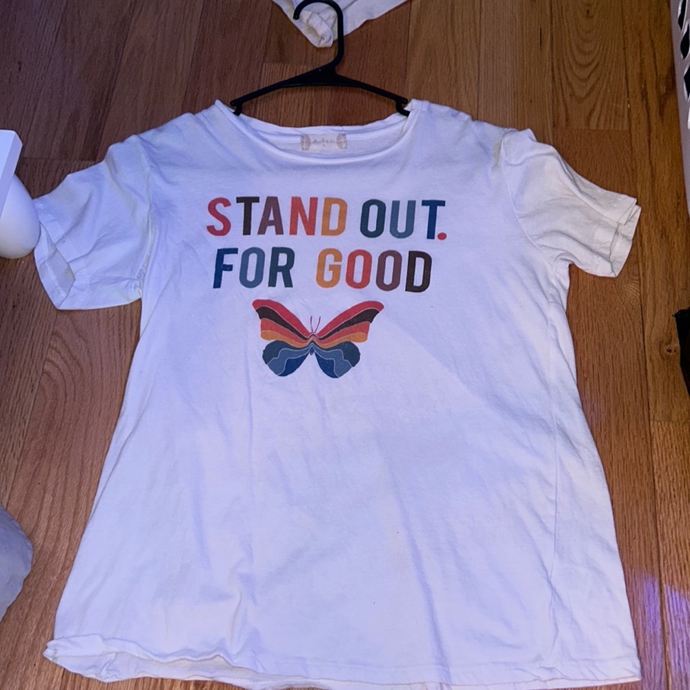 a medium, oversized tshirt that is white and fairly new